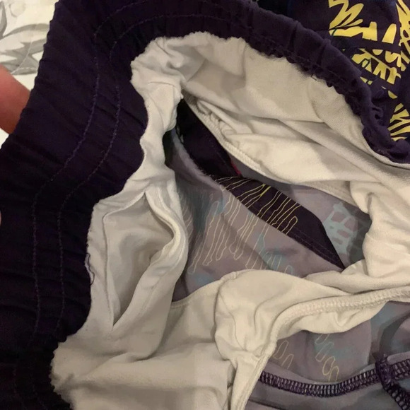 Under Armour heat gear shorts (Purple background, pink, yellow & blue print). - Picture 3 of 4